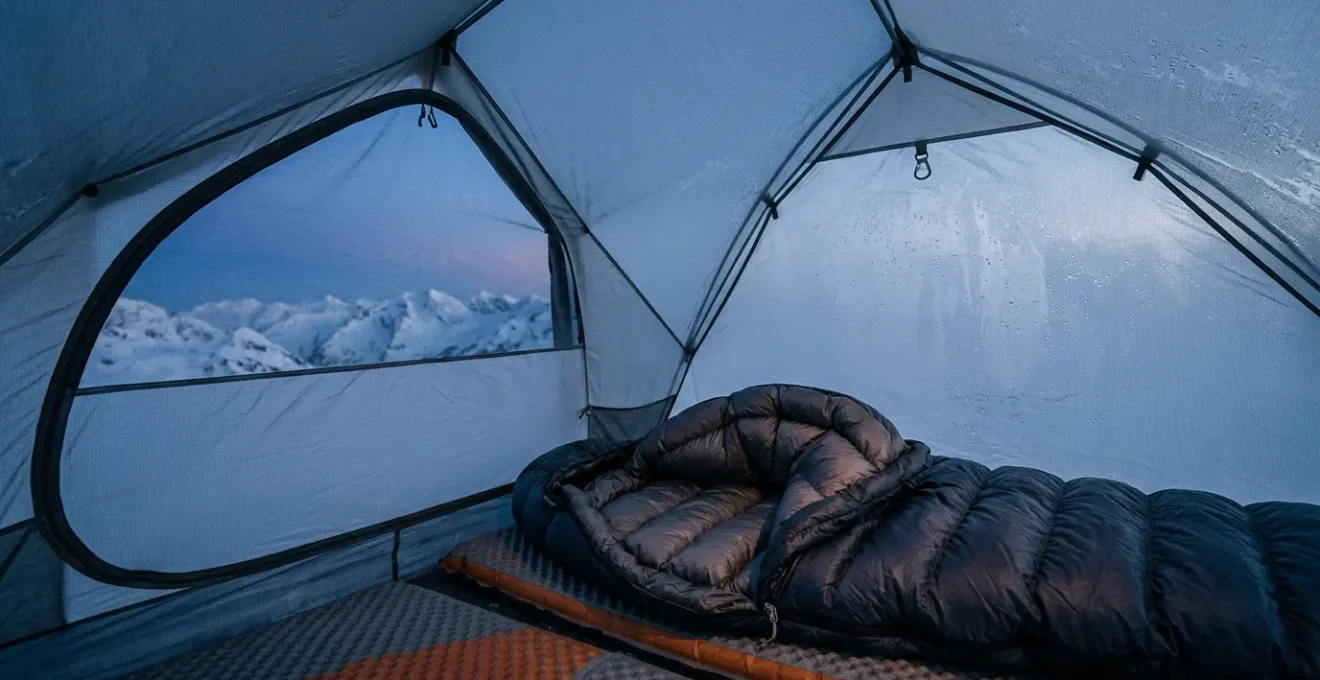 Close-up of a down sleeping bag lofted inside a tent during freezing outdoor conditions