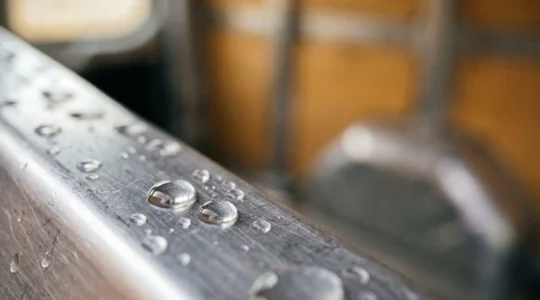 Condensation droplets on van metal interior surface showing moisture management challenge