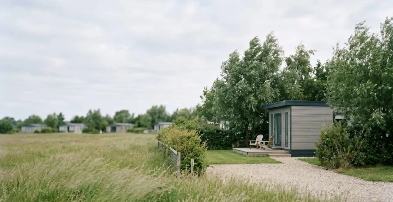 Peaceful luxury mobile home nestled in a tranquil corner of a resort park with natural privacy screening